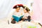 Two girls in pirate\'s costumes reading fairy-tale