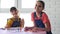 Two girls play board games and have fun looking at the frame