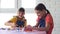 Two girls play board games joyfully and cheerfully