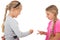 Two girls playing rock paper scissors