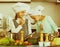 Two girls preparing vegetables and smiling indoors