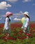 Two girls in a red field