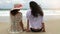 Two girls relaxing on beach in slow motion