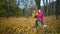 Two girls riding on a swing in the fall in nature in the Park