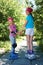 Two girls in roller skates looking at the camera.