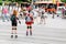 Two girls roller skating dangerous ride on the roadway