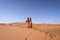 Two girls in the Sahara desert. Merzouga Morocco