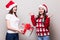 Two girls share Christmas gift box