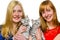 Two girls showing young silver tabby cats