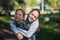 Two girls sisters or girlfriends having fun outdoors.