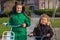 Two girls sisters ride bicycles. Dutch kids enjoy cycling every day