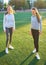 Two girls in sportswear posing at the stadium.Portrait of two sports girlfriends at the sports stadium