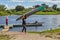 Two girls sportswoman carrying kayak on shoulder, Polotsk, Belarus.