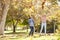 Two Girls Throwing Autumn Leaves In The Air