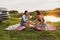 two girls are traveling on the roads by car and stopped for a roadside picnic