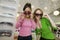 Two Girls Trying on Sunglasses in Boutique portrait