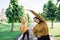 two girls in veil do arm stretches by raising their arms upward with their bodies leaning to the side