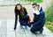 Two girls walks in autumn park.