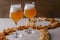 Two glass of beer and beer snacks over white background. Potato chips and popcorn shaped like an 8.