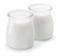 Two glass containers with plain yoghurt isolated on white background