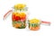 Two glass jars with clips with colorful vegetables