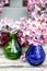 Two glass vases dried pale pink hyrdragea wreath