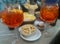 Two glasses of aperol spritz with hors d`oeuvres of green olives, chips and peanuts