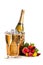 Two glasses of champagne, a bucket with a bottle of champagne and ice and a bouquet of multi-colored roses