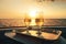 two glasses of champagne sitting on a tray on a boat