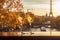 Two glasses of champagne on a table of romantic cafe or restaurant with view to Eiffel tower in Paris, France