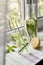 Two glasses of cucumber, lemon and mint  water on a light linen tablecloth on the windowsill