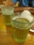 Two glasses of draft beer.