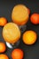 Two Glasses with Fres Orange Juice with orange and Tangerine Fruits on Dark table background, Top view. Healthy Food