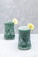 Two glasses of healthy green spirulina smoothie