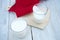 Two glasses of kefir on a white wooden background.