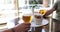 Two glasses of light beer in male hands in cafe