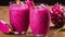 Two glasses of pink drink with pineapple on table