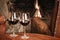 Two Glasses Of Red Wine At A Cosy Fireplace