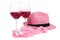 Two glasses of red wine near pink panties