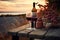 Two glasses of red wine on wooden table of outdoor restaurant on a background of scandinavian landscape. Drinking wine in outdoor