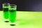 Two glasses of sweet alcoholic green liqueur