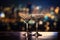 Two glasses of wine on the background of the night city and bokeh