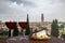 Two glasses of wine with charcuterie assortment on view of Verona, Italy. Glass of red wine with different snacks - plate with ham