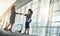 Two go getters coming together. Low angle shot of two attractive young businesswomen shaking hands while standing in a