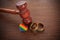 Two gold wedding rings with lgbt rainbow colours. Homosexual marriage. Lgbt rights and law.