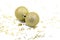 Two golden christmas balls baubles on a white background with blurry golden stars