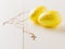 Two golden eggs on a white wooden table. The decoration of the Easter table.