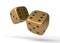 Two golden rolling gambling dice in Flight on a white background