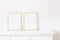 Two golden vertical frames on white furniture, luxury home decor and design for mockup creation