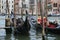 Two gondolas are moored at the wharf on the Grand Canal in Venice